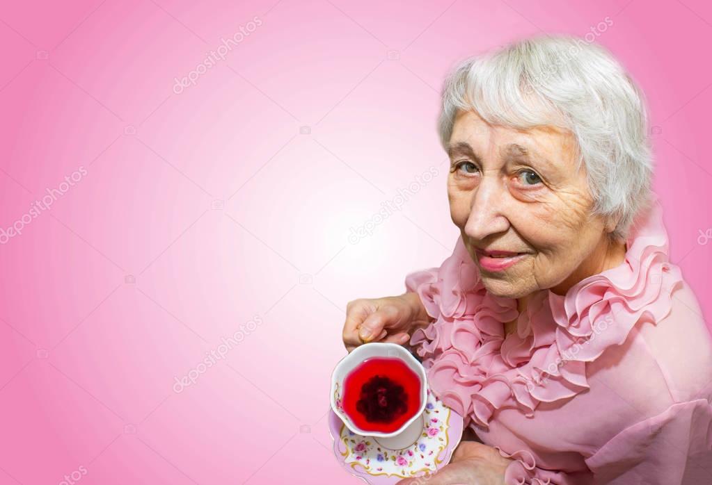 Senior Woman Enjoying Cup Of Tea