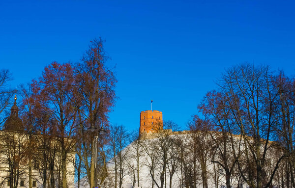 View on Gediminas tower on the castle hill in the old town of Vilnius city in Lithuania at winter. This tower is very popular tourist destination in Vilnius