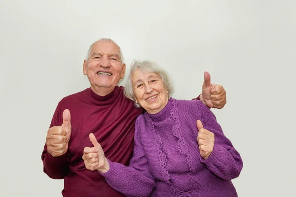 Senior couple showing ok thumbs up isolated on white background — Stock Photo, Image