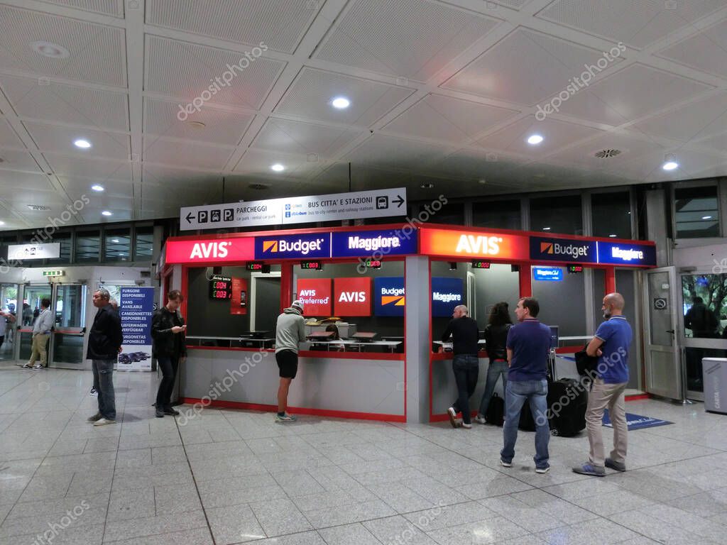 Genoa, Italy - September 10, 2019: The car rental terminals at airport at Genoa, Italy