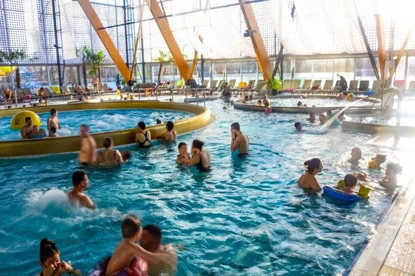 Poprad, Slovakia - December 31, 2019: People resting at Waterpark AquaCity in Poprad — 스톡 사진