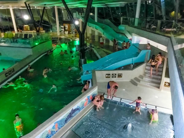 Michalovce, Slovakia - December 30, 2019: People resting at swimming pool in Thermal park Sirava — Stock Photo, Image