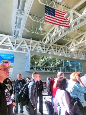 Miami, Florida, USA - November 29, 2019: Unidentified people lined up for security and passport control at International Airport in Miami FL.