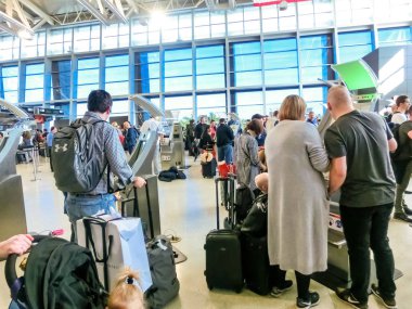 Miami, Florida, USA - November 29, 2019: Unidentified people lined up for security and passport control at International Airport in Miami FL.
