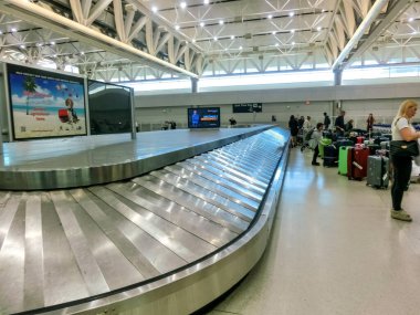 Miami, Florida, USA - November 29, 2019: Travelers inside Miami International Airport in Miami FL. The airport ranks first in the United States by percentage of international flights.