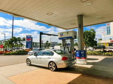 Fort Lauderdale - December 1, 2019: People fill up their cars at Chevron gas station at Fort Lauderdale on December 1, 2019. Chevron is a multinational energy corporation it employs 64,600 people