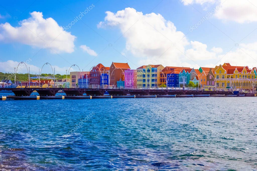 People at Queen Emma Bridge in front of Punda district, is a pontoon bridge St. Anna Bay at Willemstad, Curacao, Netherlands