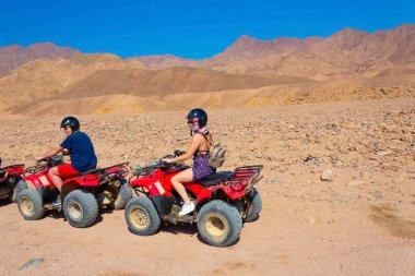 Sharm El Sheikh, Egypt - February 17, 2020: The people at quad tour in the desert in Egypt on vacation panorama