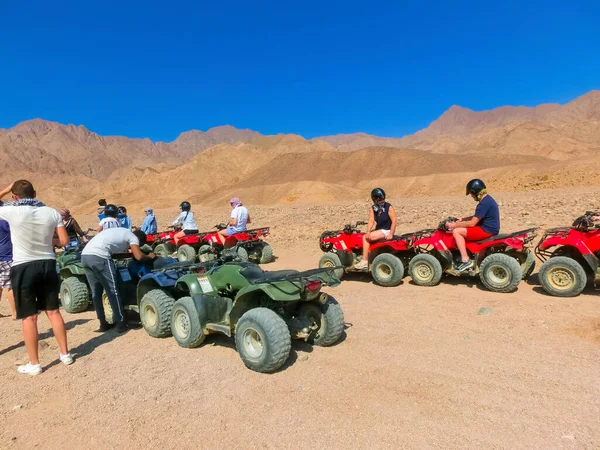 Sharm El Sheikh, Egypt - February 17, 2020: The people at quad tour in the desert in Egypt on vacation panorama