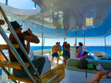 Sharm El Sheikh, Egypt - February 16, 2020: Sail boat ship with tourists in Ras Mohamed National Park in the Red Sea, Sharm El Sheikh, Egypt