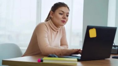 Successful office girl raising hands with joy