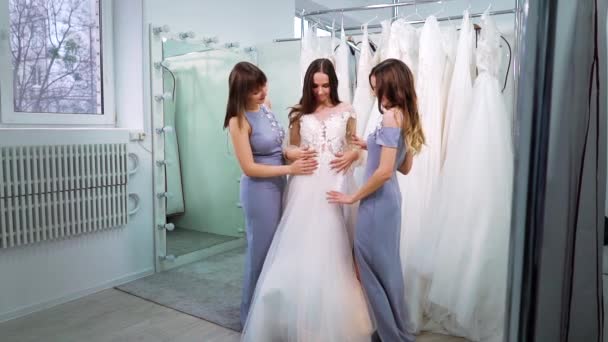 Happy bride with bridesmaids in elegant outfits in wedding salon — Αρχείο Βίντεο