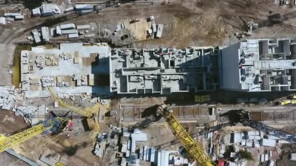 Aerial top down of builders working on construction site — Stock Video