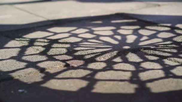 Shadow of swaying swing on empty playground due to covid pandemic — Stock Video