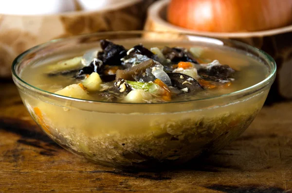 Soup mushrooms glass bowl spoon — Stock Photo, Image