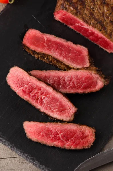 Beef rare steak sliced plate — Stock Photo, Image