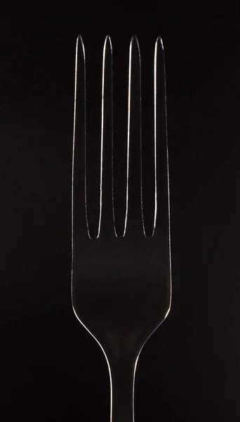 Fork contour on a black background — Stock Photo, Image