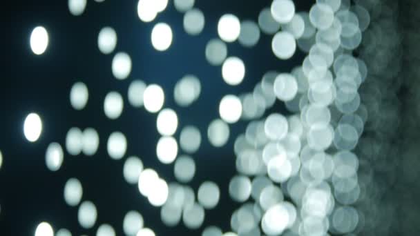 Moving particles, blurred, bokeh lights background. Abstract sparkles. — Stock Video