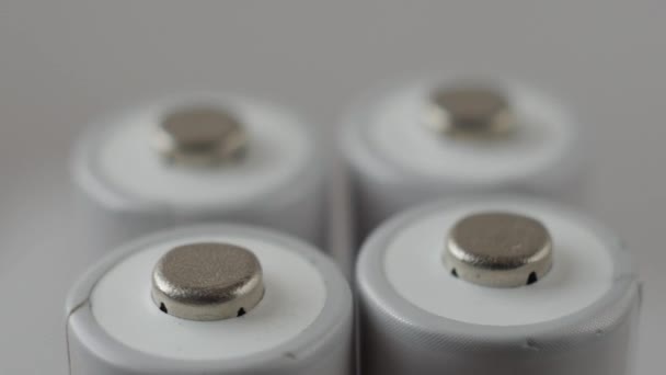 Positive terminals of batteries rotating slowly — Stock Video