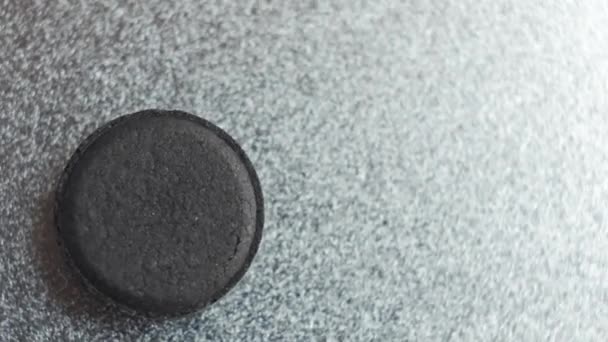 Closed up Activated charcoal carbon pills — Stock Video