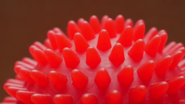 Red massage ball rotation closeup — Stock Video