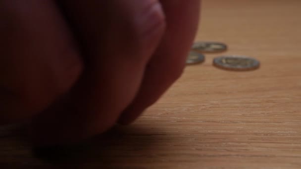 Close up of coins and dices on wooden background — Stock Video