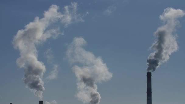 Air pollution by smoke coming out of the factory chimneys. — Stock Video