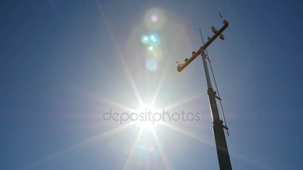 The anemometer in the suns rays measures the wind speed. — Stock Video