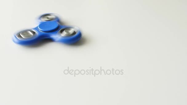 Rotating fidget spinner on a white background — Stock Video