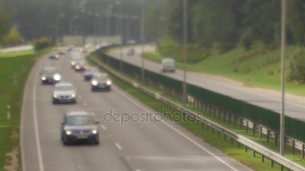 Cars running on highway down street. Four lanes two direction. Vilnius transport traffic. — Stock Footage Cars running on highway down street. Four lanes two direction. Vilnius transport traffic. Video Clip