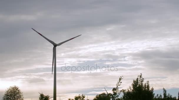 Wind turbine farm, electric power generators, on field on cloudy sky background. — Stock Video