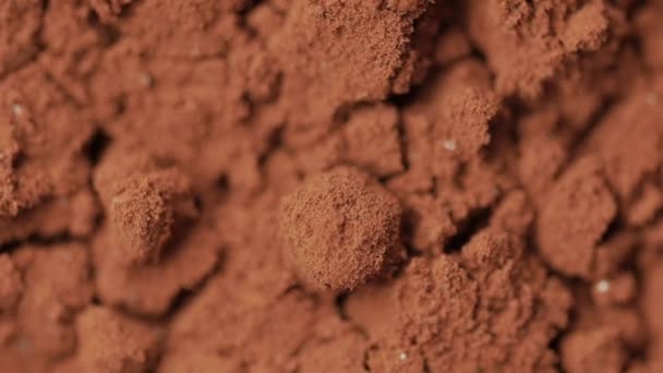 Tiro macro giratorio de polvo de cacao . — Vídeos de Stock