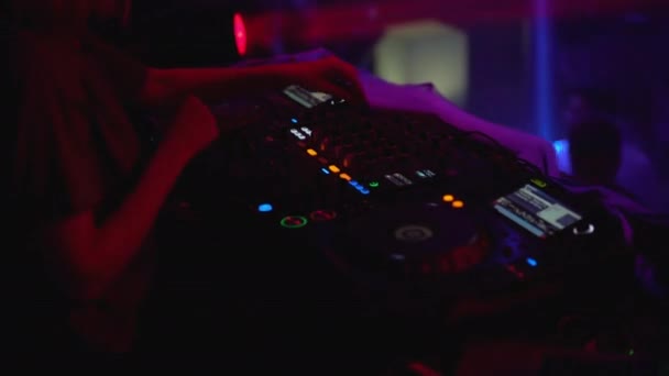 Professional dj performing at music party in club, many people on dance floor — Stock Video