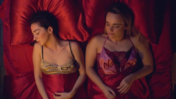 depositphotos_325727724-stock-video-two-women-sleeping-in-bed.jpg