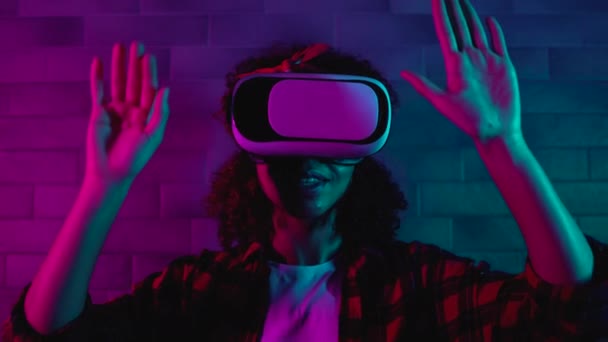 Active teen girl playing game in vr headset, having fun in virtual reality world — Stock Video