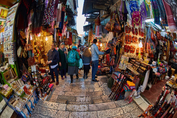 Jerusalem - 04.04.2017: Tourists walk trough Jerusalem market 