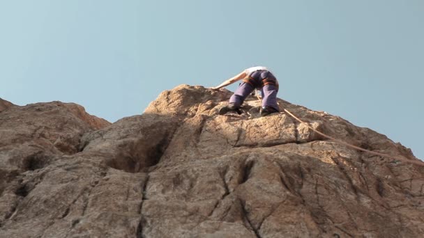 Young Woman Climbing Rock — Stock Video