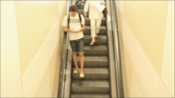 People on escalator at train station — Stock Video