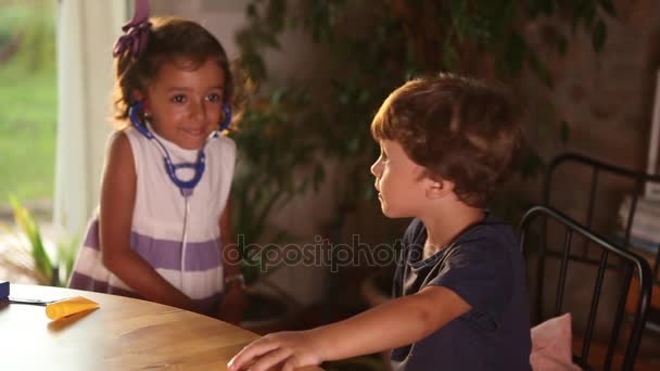 Girl and Boy Playing Doctors — Stok Video