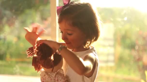 Girl Playing Doctors with Doll — Stock Video