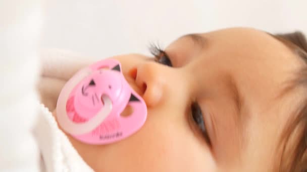 Adorable baby girl with pacifier — Stock Video