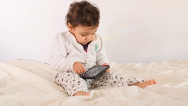 Adorable baby playing with tablet — Stock Video