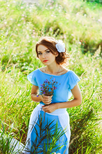 Girl in a dress in the woods