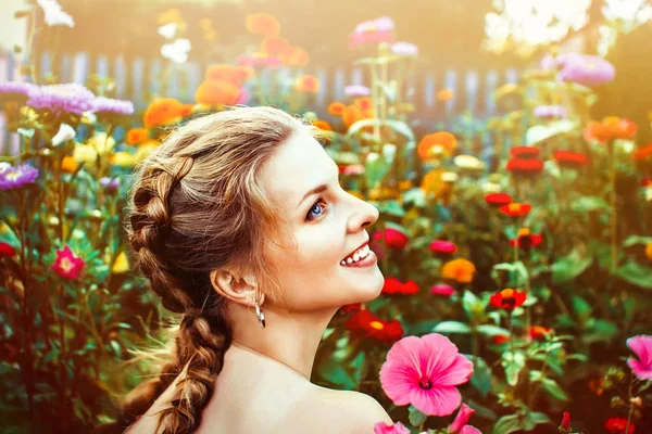 Woman in the summer garden — Stock Photo, Image