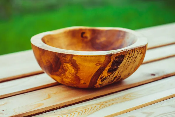 Wooden bowl in the nature