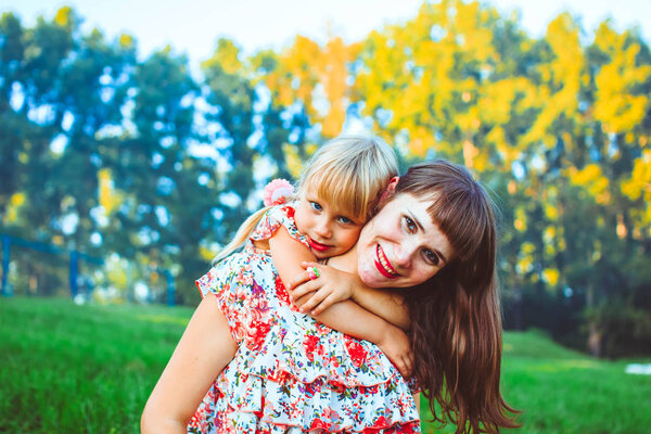 Girl with mom in nature