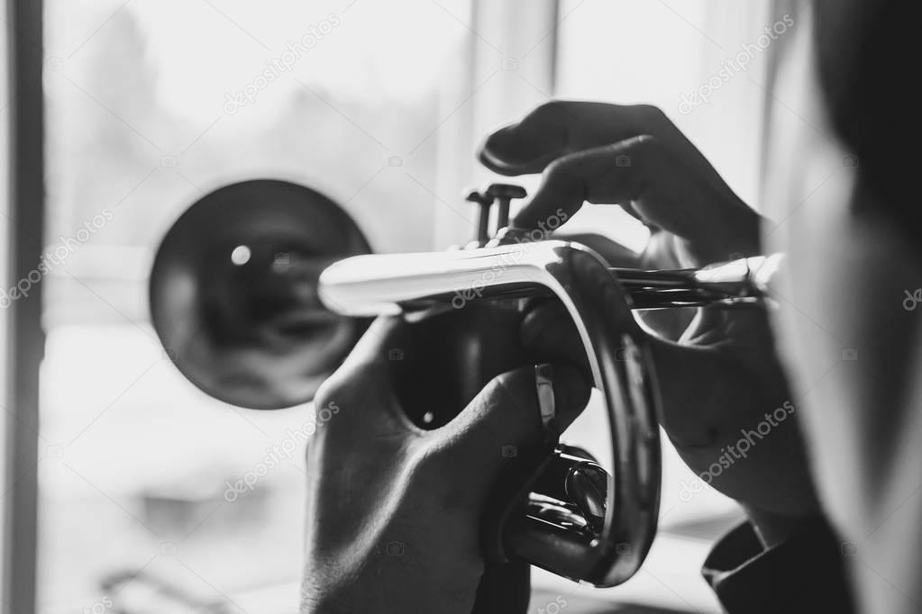 man plays the trumpet