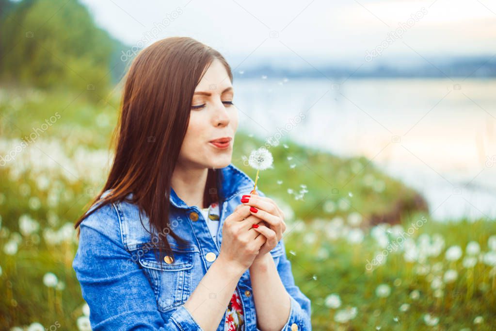 Woman among dandelions
