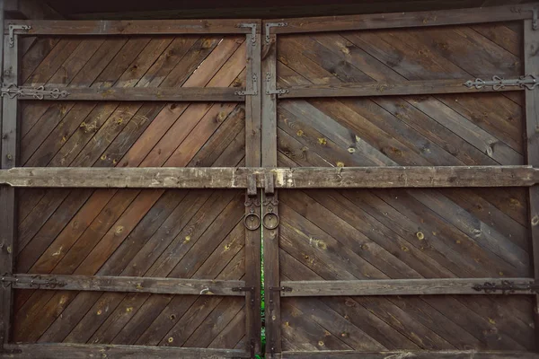 Old wooden gate with a bolt — Stock Photo, Image