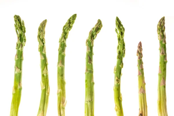 Fresh green asparagus shoots pattern, top view. Isolated over white. Food background asparagus flat lay pattern — Stock Photo, Image